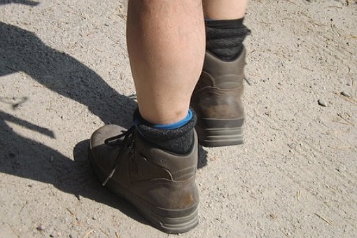 Feet of walker wearing boots